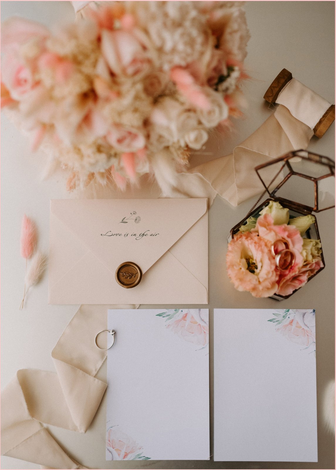 Invitation, ribbon, sealed wax and flowers — stationery as part of the place