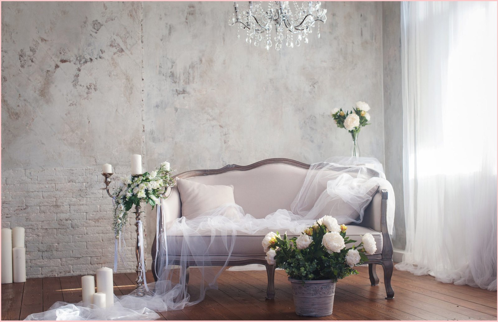 Candlelit interior with white flowers and a chandelier