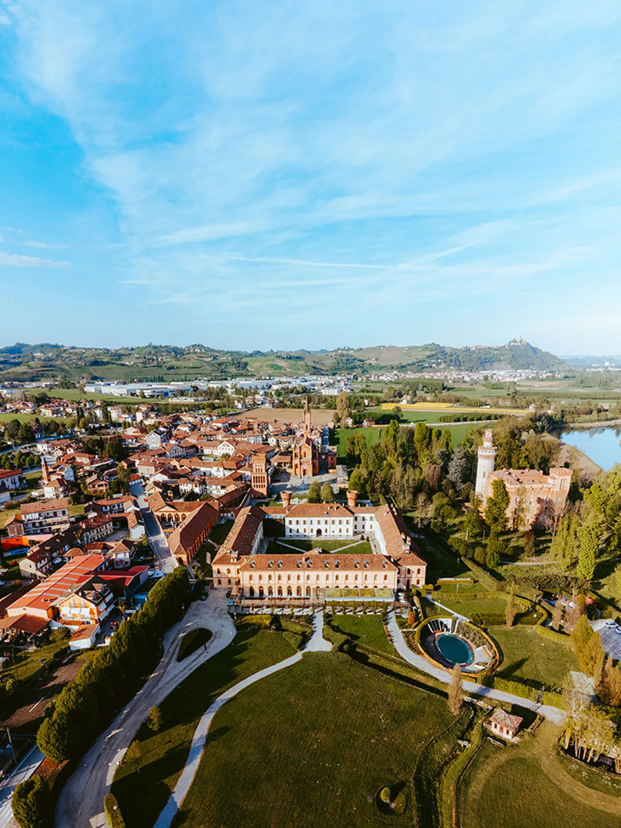 Aerial view of the Tenuta di Pollenzo: the Agenzia courtyard, the park and the brick village around it.