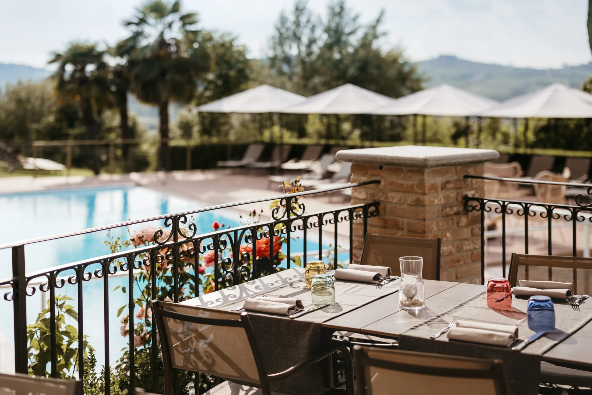 The terrace at Relais Almaranto looking over the pool toward the Monferrato hills.