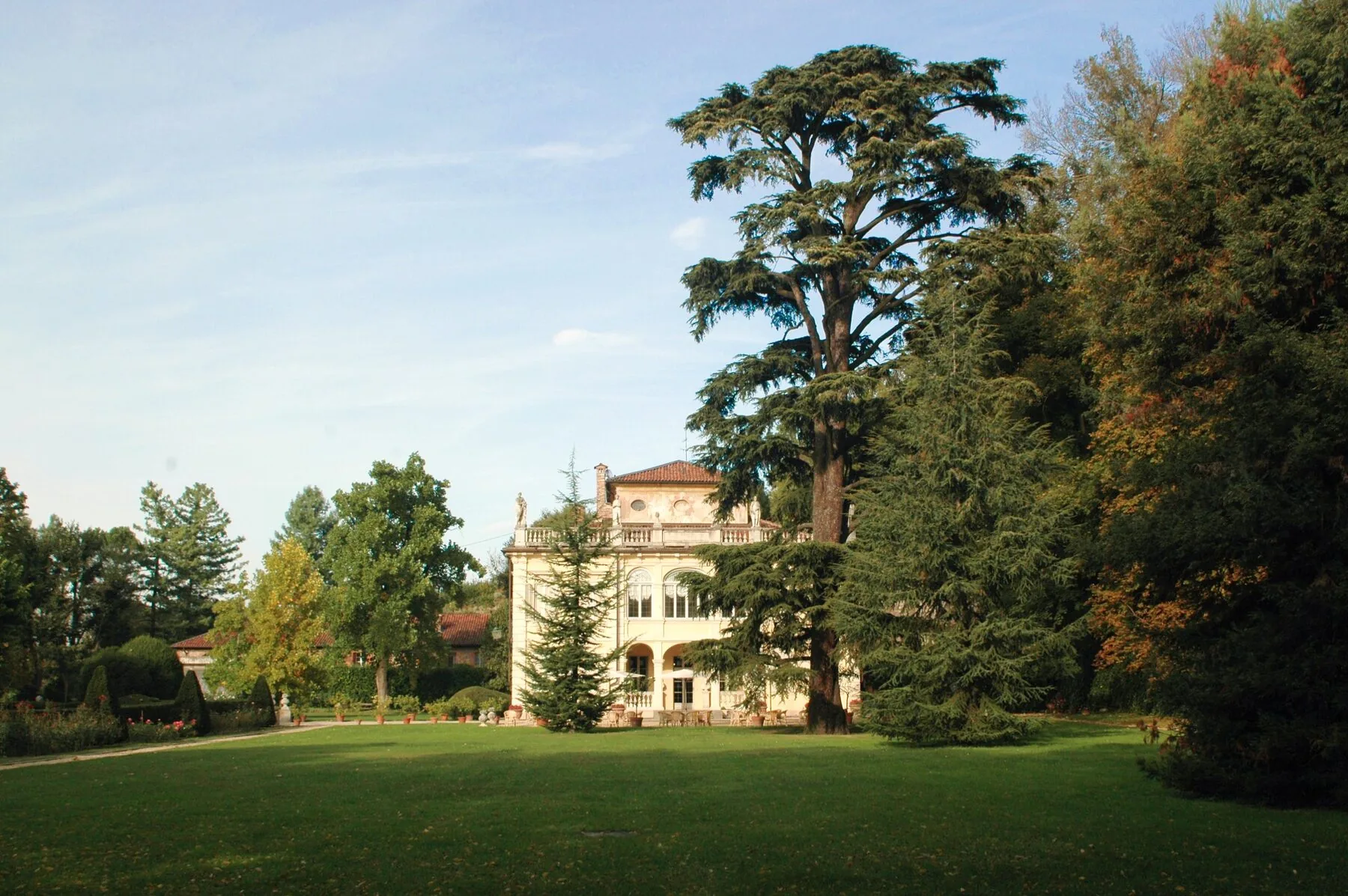 Villa d’Agliè in its park in Turin, the pale façade among cedars and lawn.
